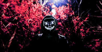 creepy_gangster_in_front_of_tree_in_the_dark